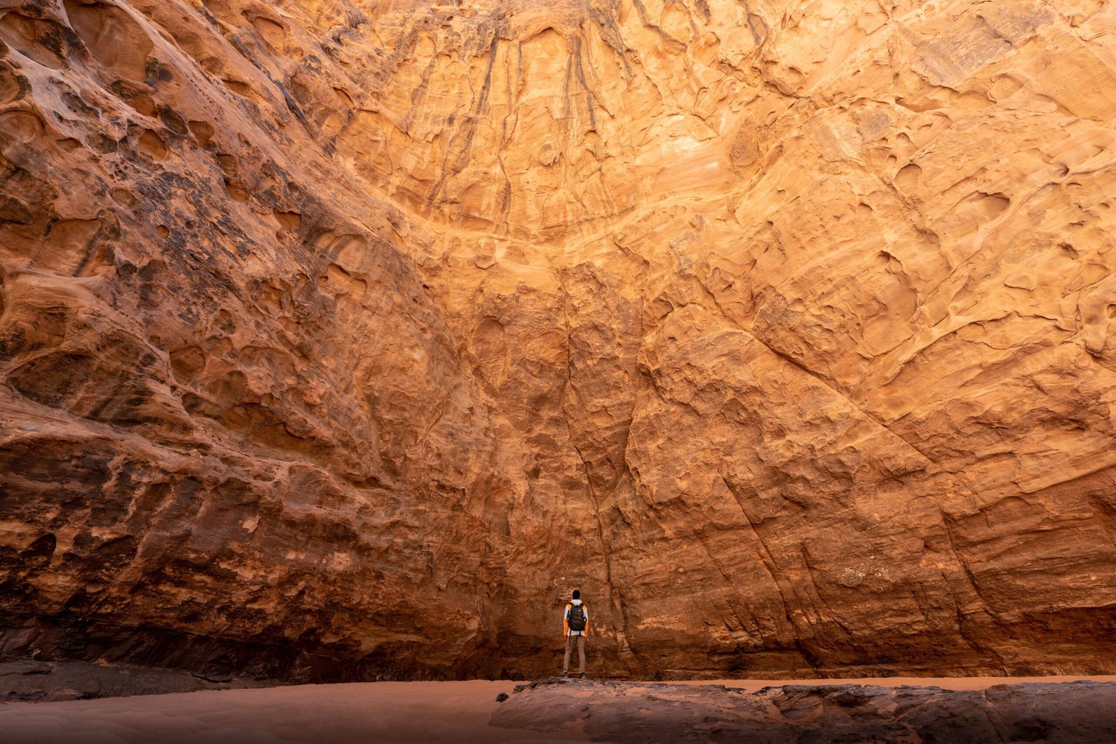 a man standing in the middle of a canyon