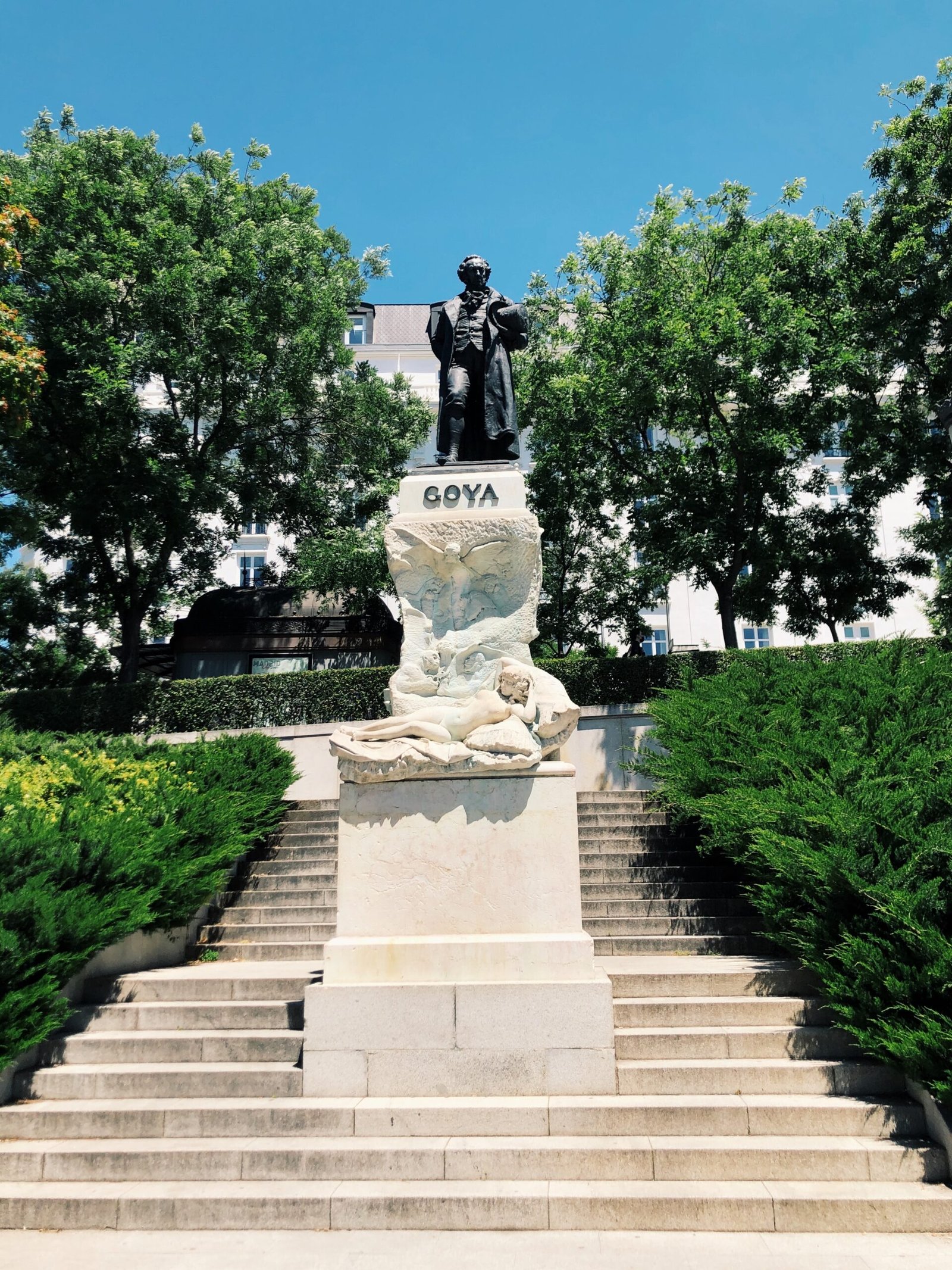 statue of man on top of a building